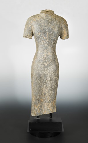 Lot 161 - A Chinese grey limestone torso of a Buddha, Northern Qi Dynasty style