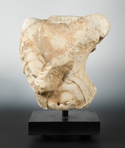 Lot 184 - A Chinese white marble fragmentary torso of a Buddhist deity, in 6th/7th century style
