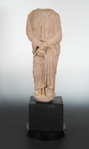 Lot 187 - A Chinese red sandstone standing figure of a Buddhist monk, in early Tang Dynasty style