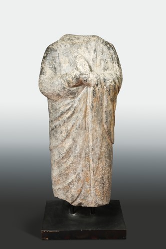 Lot 189 - A Chinese limestone standing figure of an enrobed Buddhist figure, in Wei Dynasty style