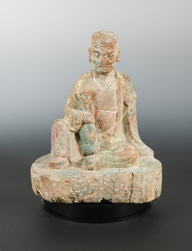 Lot 194 - A Chinese carved and polychrome wood figure of Iohan, in Yuan/early Ming style