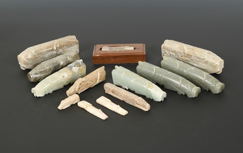 Lot 195 - Five Chinese carved jade recumbent pig "hand warmers", in Han style