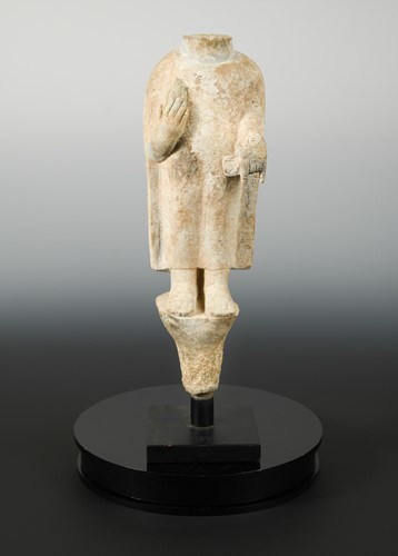 Lot 204 - A Chinese grey stone standing torso of a Buddha, in Northern Qi style