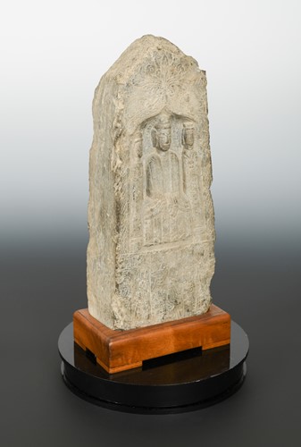 Lot 205 - A Chinese limestone Stele depicting the Buddha with a Bodhisattva, in early Tang Dynasty style