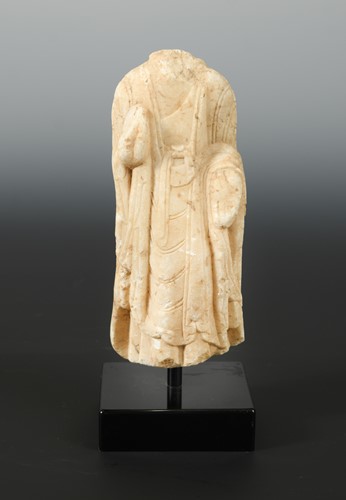 Lot 207 - A Chinese white marble fragmentary figure of a standing Buddha, hands held in a mudra