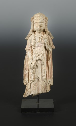 Lot 208 - A Chinese stucco standing figure of Guanyin, in 6/7th century style