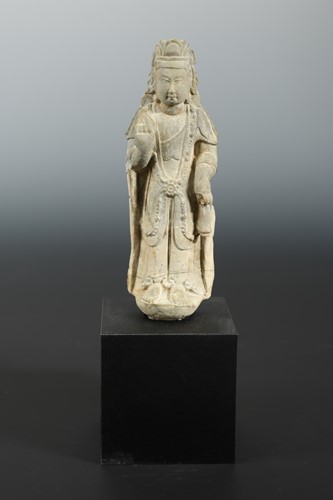 Lot 209 - A Chinese limestone standing figure of Avalokiteshvara, in 6/7th century style