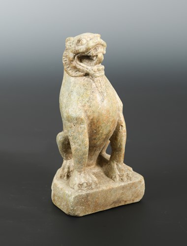 Lot 210 - A Chinese green stone seated lion, in late Tang Dynasty style