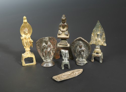 Lot 212 - Seven Chinese bronze and gilt bronze small votive Buddhist figures, in 5th-7th century style
