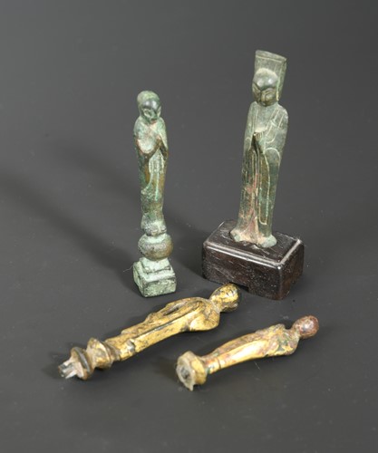Lot 213 - Four Chinese bronze and gilt bronze small votive standing Buddhist figures, in 8-10th century style