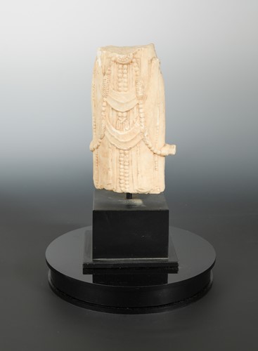 Lot 215 - A Chinese white marble fragmentary figure of Guanyin, in 6/7th century style, mid torso only