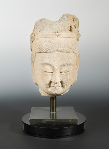 Lot 218 - A Chinese sandstone head of a crowned Buddha, in Tang Dynasty style