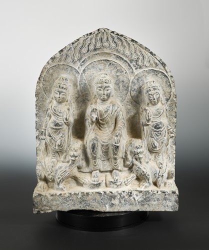 Lot 220 - A Chinese limestone Buddha triad group stele, in Northern Wei Dynasty style