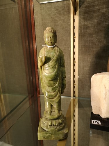 Lot 223 - A Chinese jade type stone standing figure of a Buddha, in Sui Dynasty style