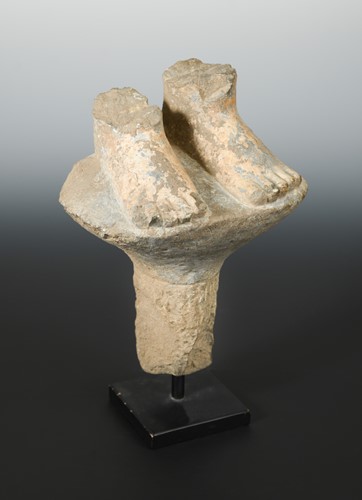 Lot 224 - A Chinese grey limestone fragment carving of the feet of a Buddhist deity, perhaps Wei/Qi Dynasty