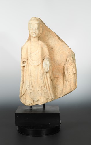 Lot 230 - A Chinese white marble Buddhist triad stele fragment,  in late Wei Dynasty style