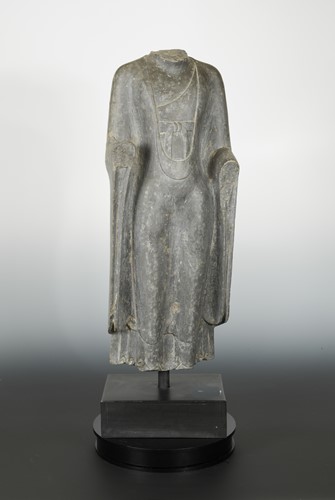 Lot 232 - A Chinese grey limestone torso of a Buddha, in Wei Dynasty style