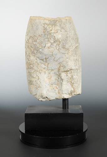 Lot 233 - A Chinese limestone carved mid-torso fragment of a Buddha, in Wei Dynasty style