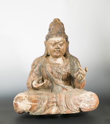Lot 238 - A Chinese carved and polychrome wood seated figure of Maitreya, with elaborate chignon, in Liao Dynasty style.