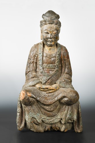 Lot 240 - A Chinese carved and polychrome wood seated figure of Guanyin, perhaps late Ming Dynasty