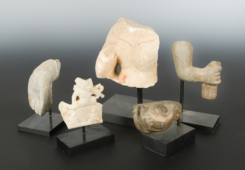 Lot 241 - A group of Chinese white marble and limestone  Buddhist head/hand/torso fragments, in Northern Wei/Qi style