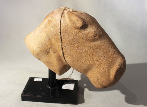 Lot 246 - A Chinese red and white mottled marble head of a horse, in Han Dynasty style