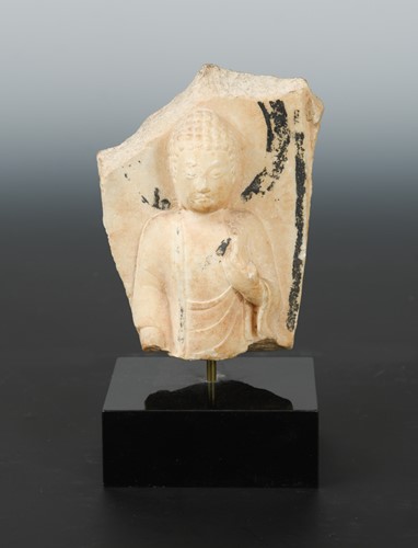Lot 248 - A Chinese white marble fragmentary figure of a Buddha, head and upper body, with vestigial painted aureole, in 6th/7th century style