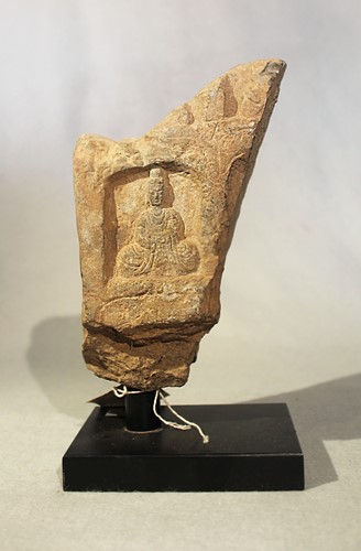 Lot 249 - A Chinese grey stone stele fragment with Buddhist deities in relief, in Wei Dynasty style