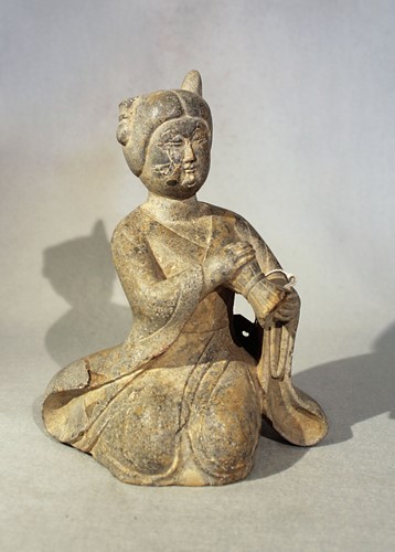 Lot 252 - A Chinese green stone figure of a  female musician, in Tang style