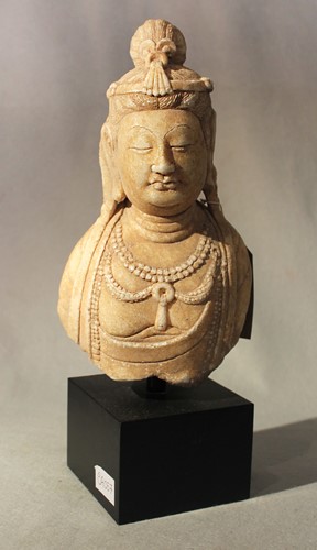 Lot 254 - A Chinese white crystalline marble upper body and head of the Bodhisattva Guanyin, in Tang style