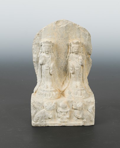 Lot 258 - A Chinese limestone double Bodhisattva stele with aureole, in Northern Qi style