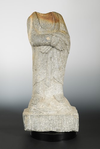 Lot 265 - A Chinese grey stone standing Buddhist deity, headless, in 6/7th century style