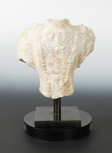 Lot 268 - A Chinese limestone fragmentary upper torso of Avalokitesvara, in 6/7th century style
