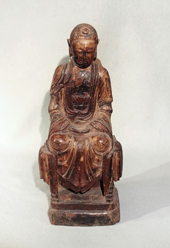 Lot 282 - A Chinese carved and polychrome painted wood figure of a seated Buddha, perhaps Ming 16th/17th century