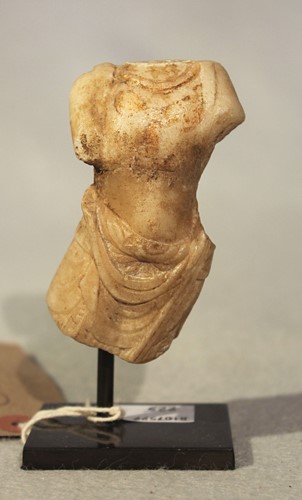 Lot 287 - A Chinese white marble fragmentary Buddhist deity torso, in 6-7th century style