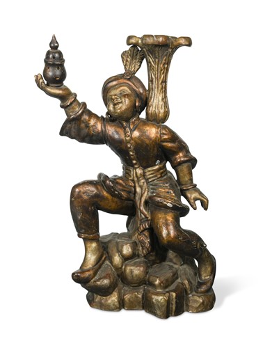 Lot 986 - A gilt and gesso carved wood figure of an eastern servant boy