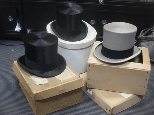 Lot 176 - Two early 20th century top hats and a grey top...