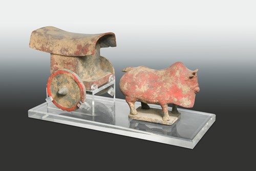 Lot 317 - A Chinese red-painted Mingqi ox-cart, probably Northern Qi Dynasty (550-577 AD)
