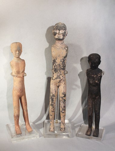Lot 318 - Three Chinese pottery 'stick' tomb figures, probably Han Dynasty