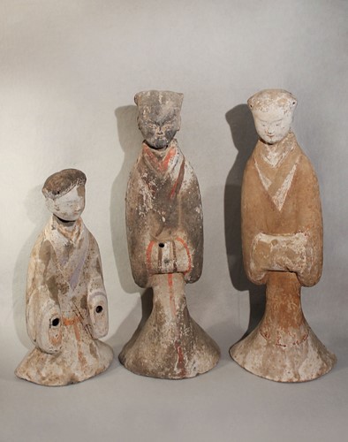 Lot 322 - A group of three Chinese painted pottery large standing female tomb attendants, probably Han Dynasty