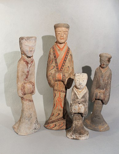 Lot 326 - A group of four Chinese painted pottery standing male and female attendants, perhaps Han Dynasty