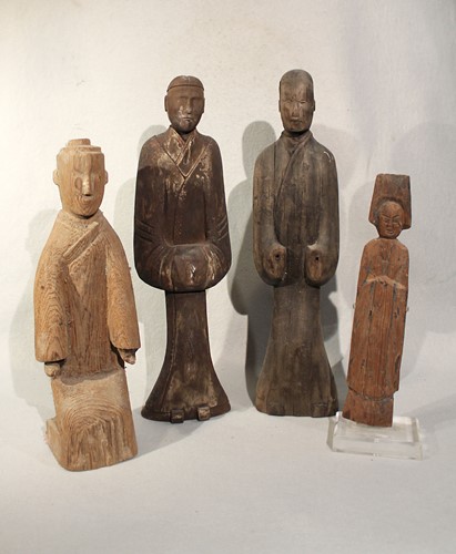 Lot 329 - A group of four Chinese carved and painted wood standing figures, in Han Dynasty style