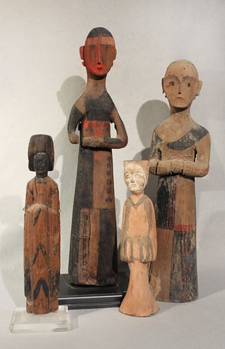 Lot 330 - A group of four Chinese carved and painted wood tomb figures, in Han Dynasty style