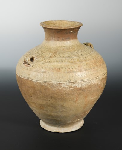 Lot 335 - A Chinese olive glazed pottery vase Hu with lug handles,  impressed/incised detail, probably Han
