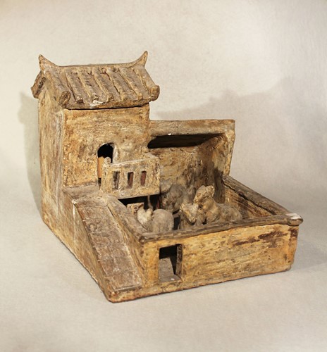 Lot 342 - A Chinese unglazed grey pottery model of a farmyard, probably Eastern Han Dynasty