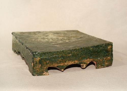 Lot 344 - A Chinese green glazed pottery square stand, cusped apron, Han Dynasty