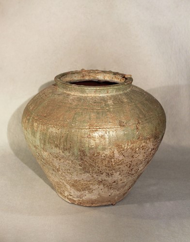 Lot 355 - A Chinese green glazed shouldered jar, probably Han Dynasty