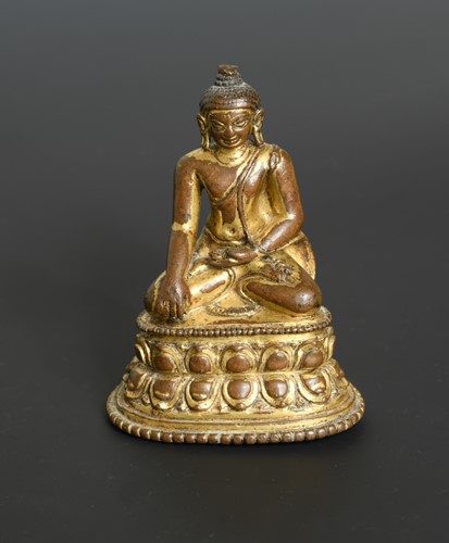Lot 373 - A Khassamalla type gilt copper Buddha, perhaps 14th/15th century