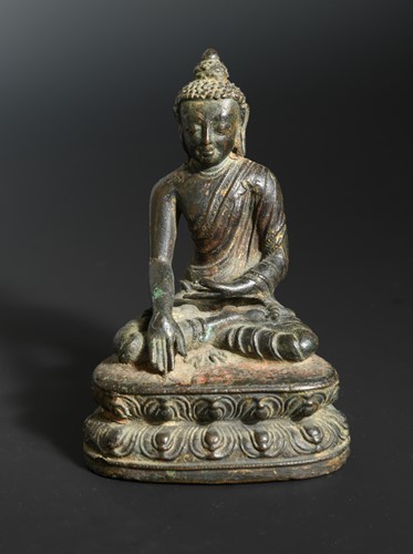 Lot 378 - A Nepalese bronze seated figure of a Buddha, possibly 15th/16th century