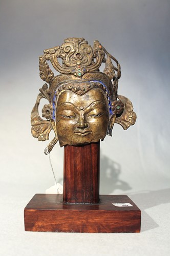 Lot 380 - A Tibetan fragmentary bronze head of Avalokiteshvara, probably 16th/17th century